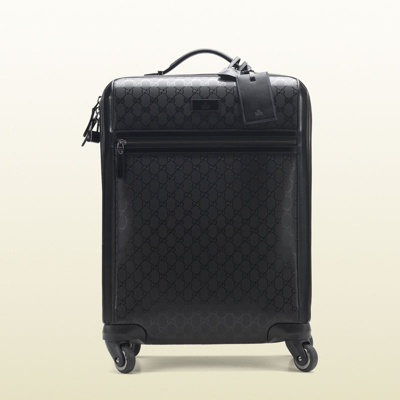 Gucci four wheel carry-on suitcase