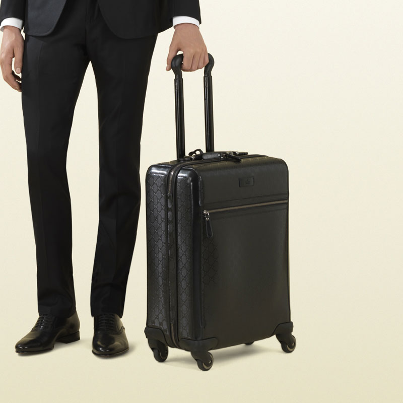 Gucci four wheel carry-on suitcase