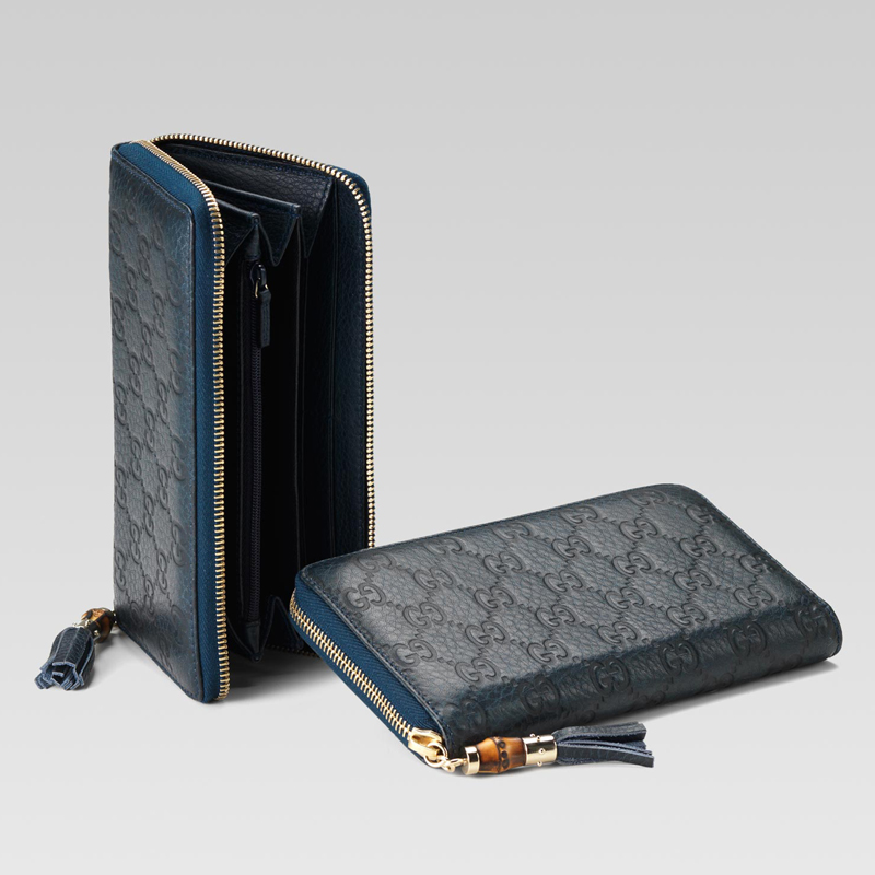 zip around wallet with tassel and bamboo detail