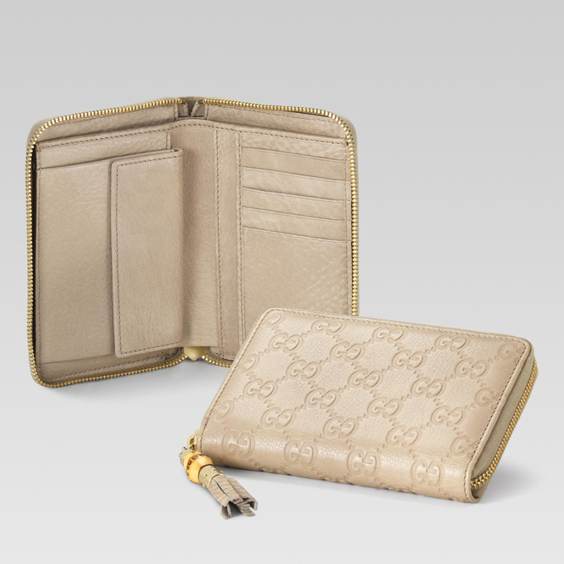 zip around wallet with tassel and bamboo detail