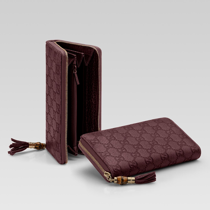 zip around wallet with tassel and bamboo detail