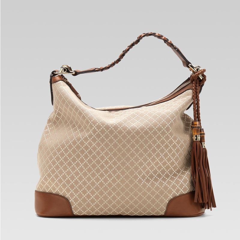 eva hobo with woven leather, tassels, and bamboo detail