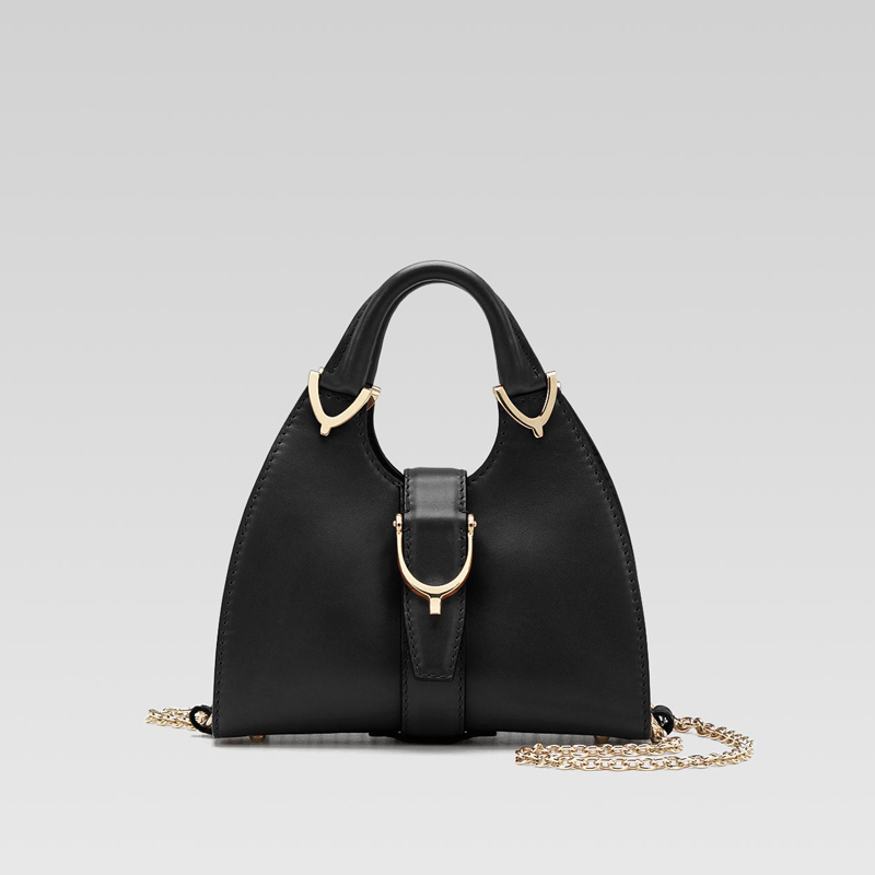 gucci stirrup top handle bag with spur detail