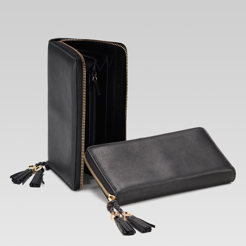 zip around wallet with tassels and G detail