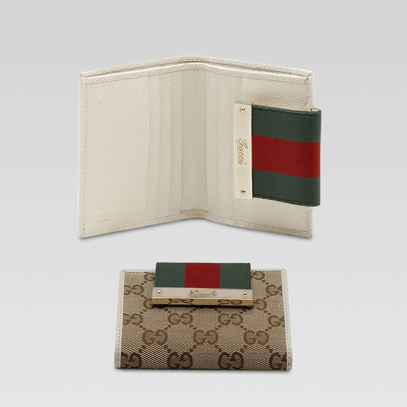 mini wallet with engraved gucci script logo.