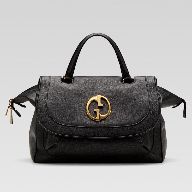 'gucci 1973' medium top handle bag with oval GG or