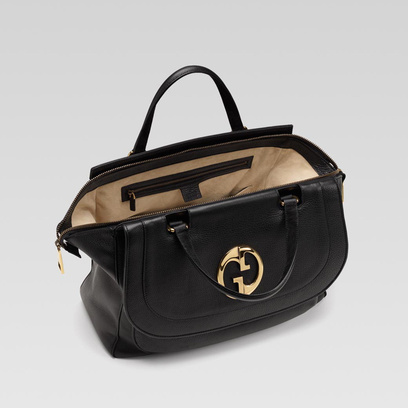 'gucci 1973' medium top handle bag with oval GG or