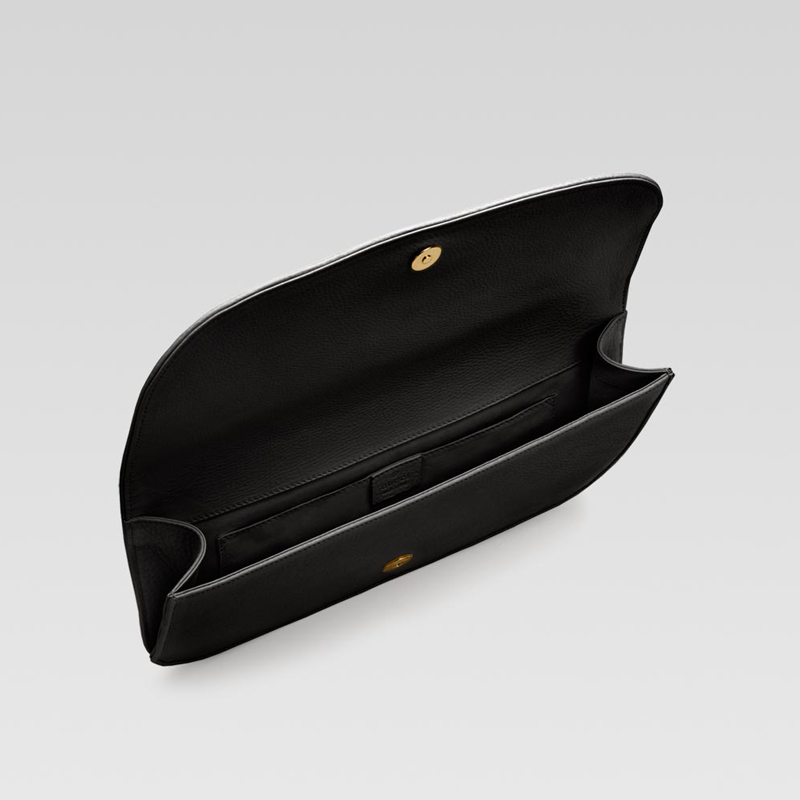 'gucci 1973' clutch with oval GG ornament