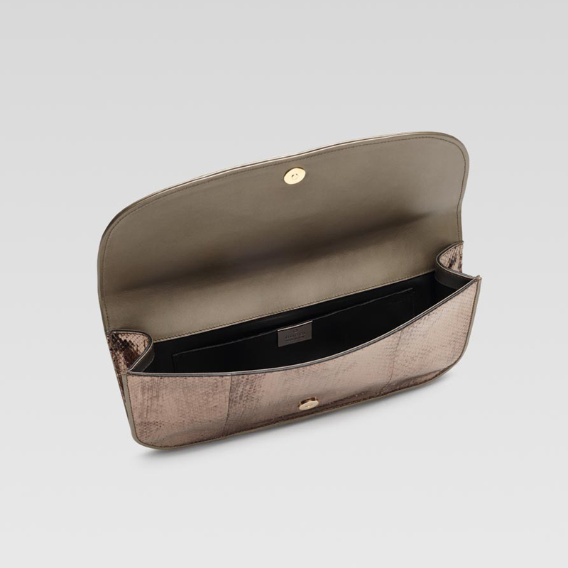 'gucci 1973' clutch with oval GG ornament