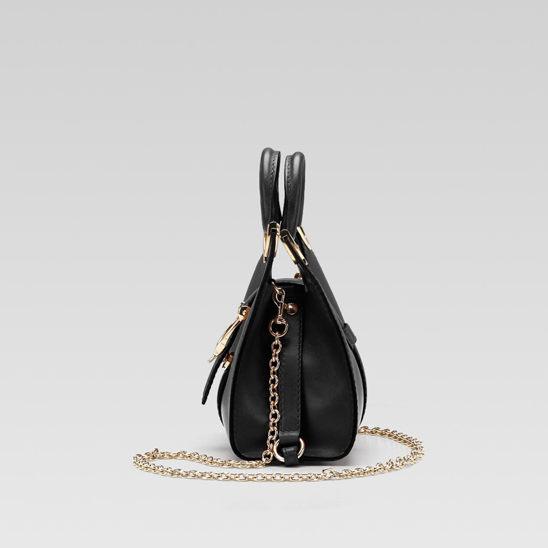 gucci stirrup top handle bag with spur detail