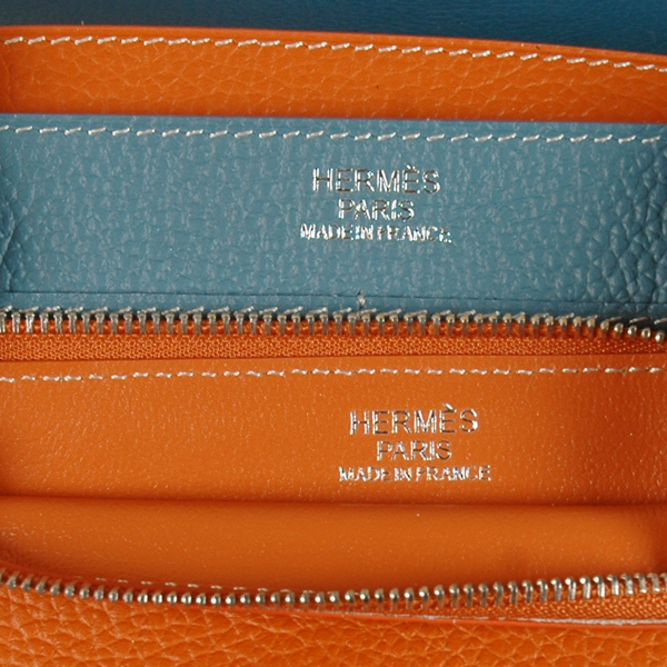 Hermes passport Wallet togo leather in Medium Blue/Orange