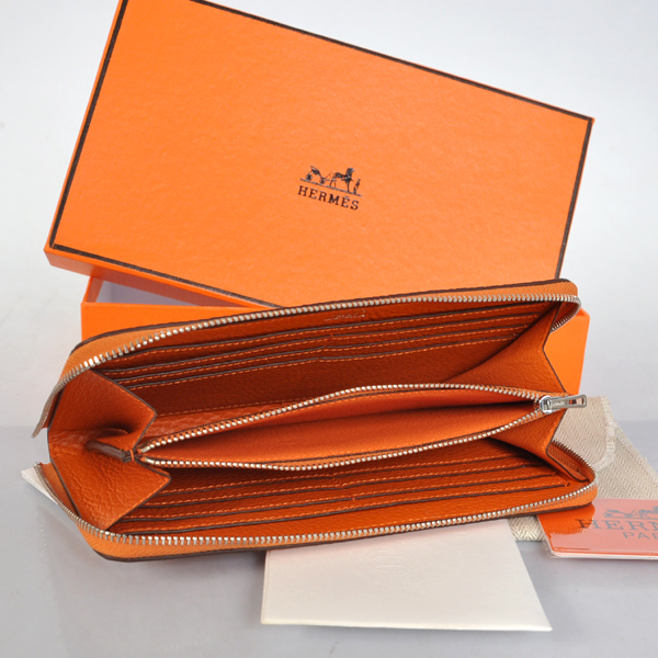 Hermes Evelyn Wallet clemence leather in Orange