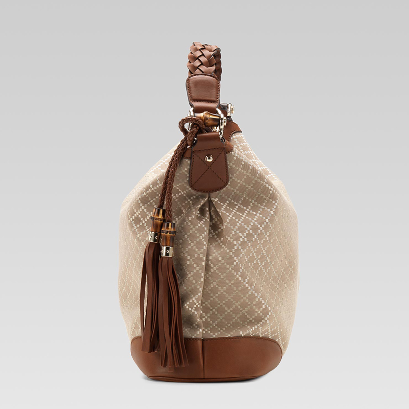 eva hobo with woven leather, tassels, and bamboo detail