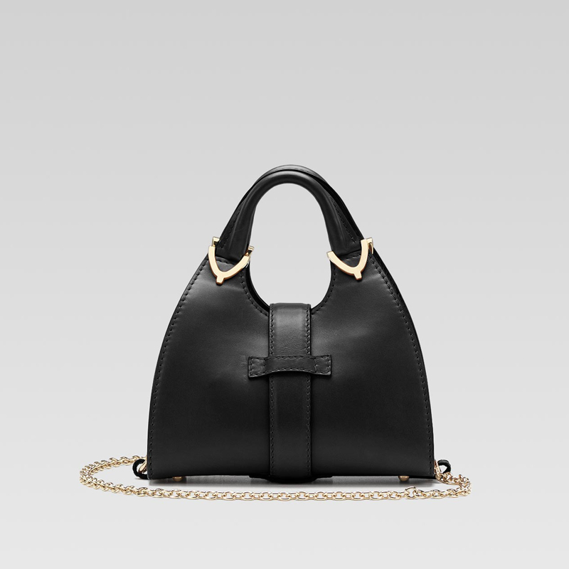 gucci stirrup top handle bag with spur detail