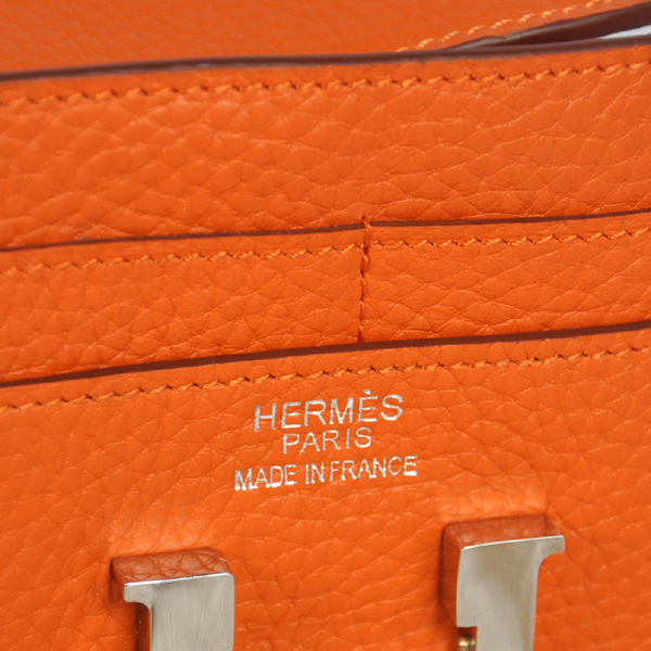 Hermes Constance Wallet clemence leather in Orange